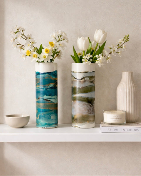 Two hand-painted cylinder vases with spring flowers