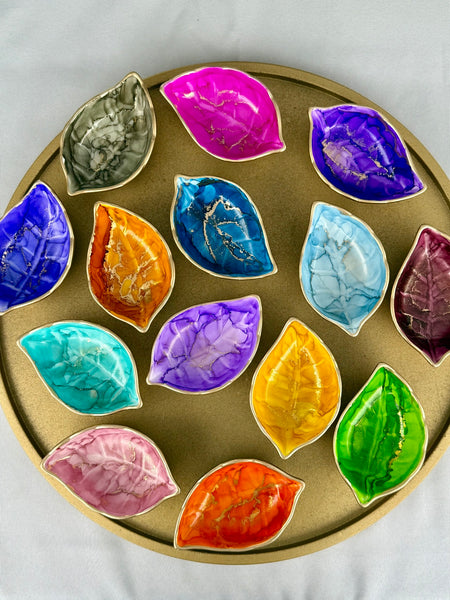 Overhead view of colorful hand painted leaf trinket dishes